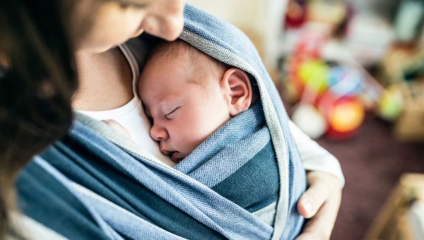 Parent holding newborn baby