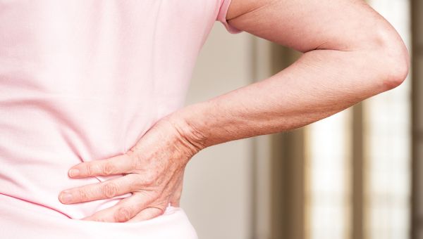back pain, senior woman experiencing back pain