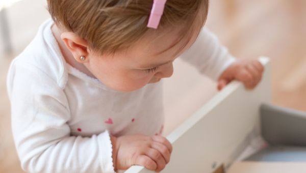 Toddler looking inside drawer