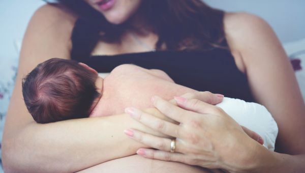 Woman breastfeeding infant