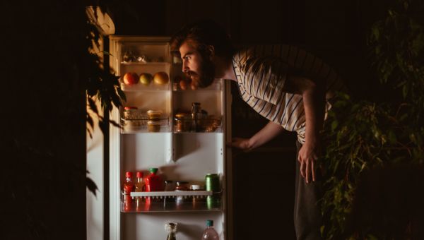 Man opening fridge for late night snack