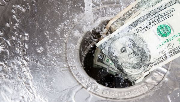 Concept of money going down the drain