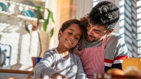 father and daughter cooking