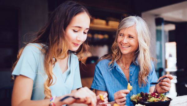 mother and daughter smiling