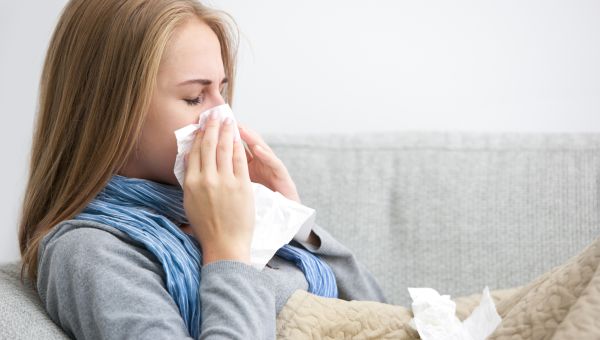 woman blowing her nose