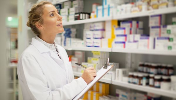 pharmacist looking at pills