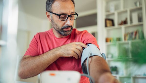 man checking blood pressure