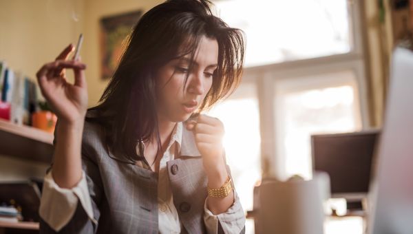 woman smoking in an office