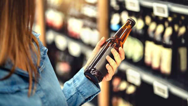 woman looking at beer