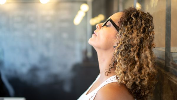 woman taking a deep breath