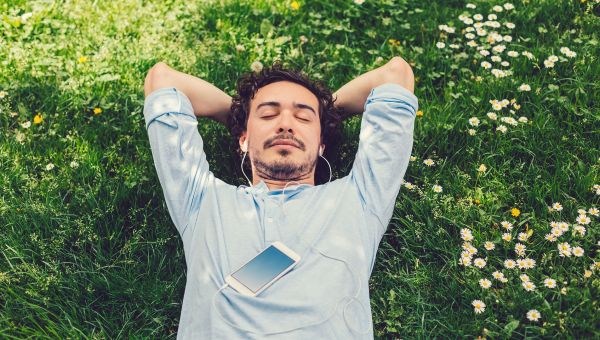 Man lying down and relaxing on the grass