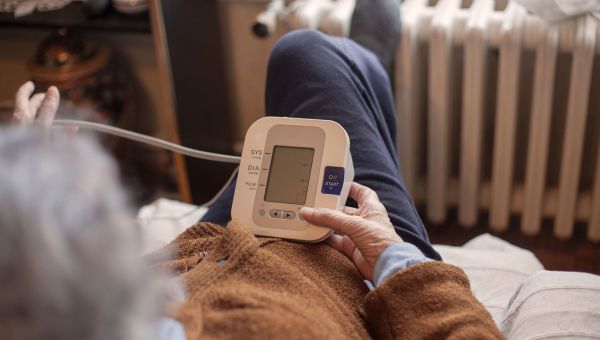 woman checking her blood pressure