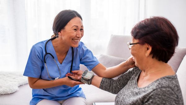 healthcare provider and patient smiling