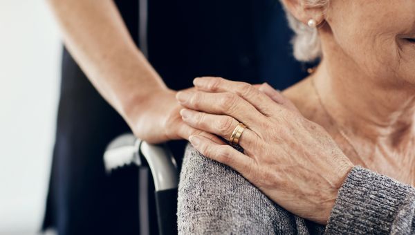 elderly woman with caregiver