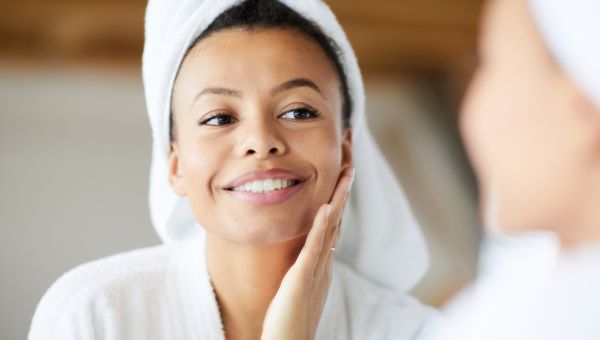 young woman looking in the mirror