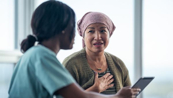 nurse talking with breast cancer patient