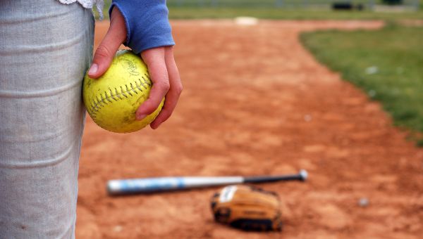 hand holding a softball