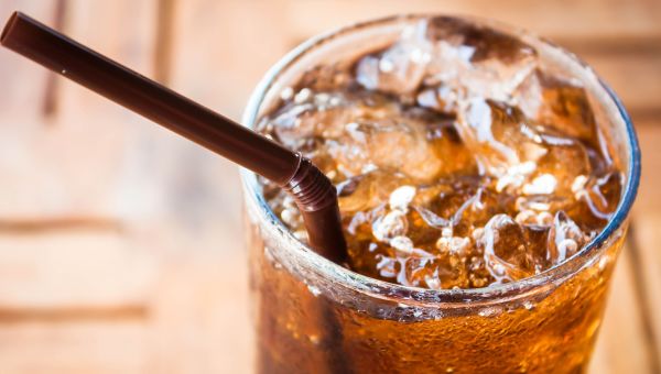 soda with a straw on ice