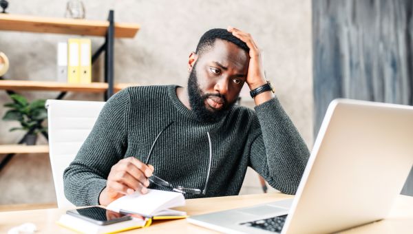 Man stressed at computer