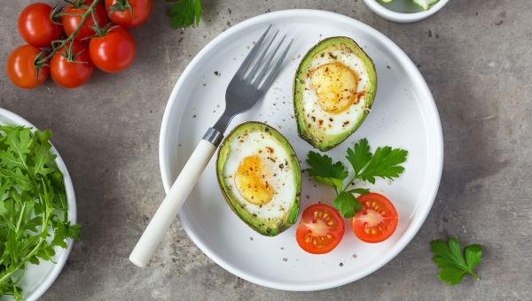 Eggs baked inside of an avocado for an energy-boosting breakfast option.