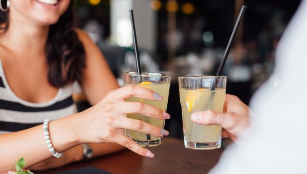 Friends drinking sugary lemonade at a restaurant.