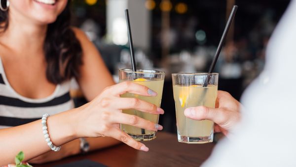 Friends drinking sugary lemonade at a restaurant.