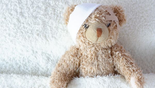 teddy bear with bandage on head