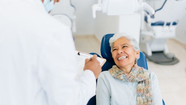 smiling senior woman at dentist