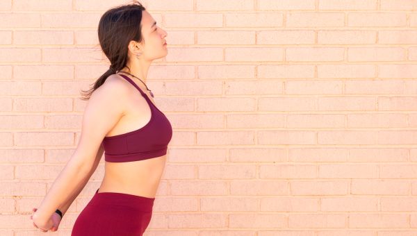 Young woman stretching and enjoying the outdoors.