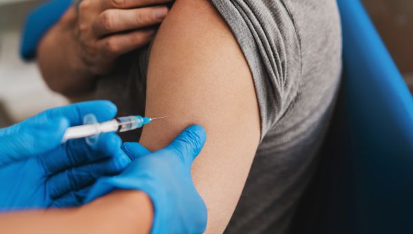 mature man receiving shingles vaccine