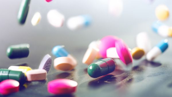 opioid pills falling on a countertop