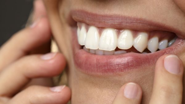 closeup of the smiling mouth of a woman