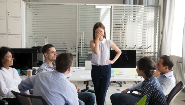 woman embarrassed while speaking at work