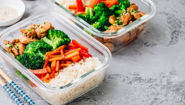 Chicken teriyaki meal prep lunch box containers with broccoli, rice and carrots 