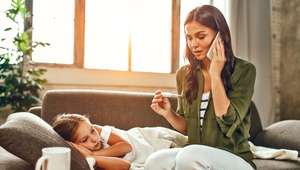 Mom with daughter who has high fever