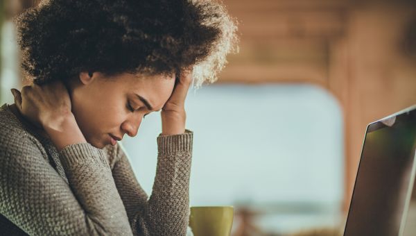 Shot of a young woman having a stressful day at work