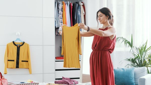 woman cleaning our her closet