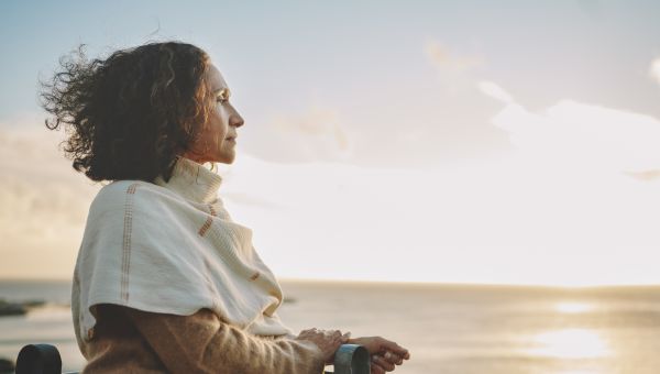 middle-aged person looking at the ocean