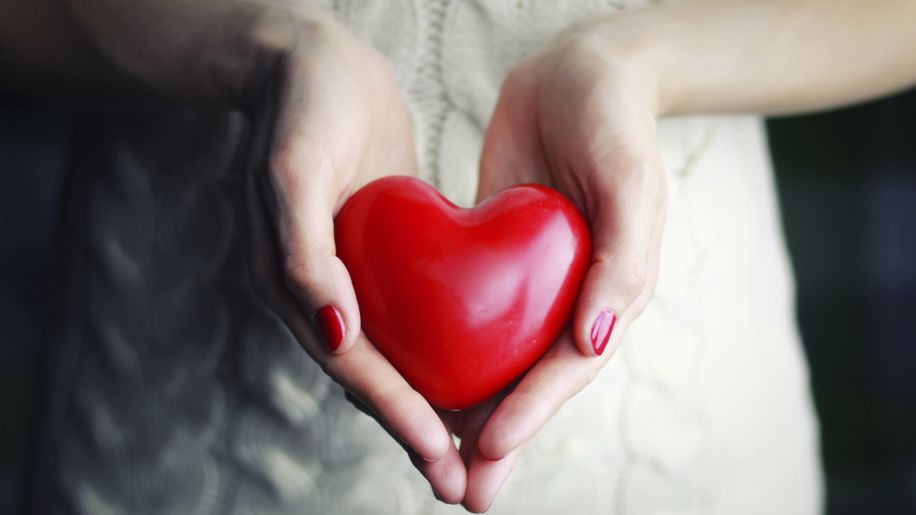 woman holding a heart