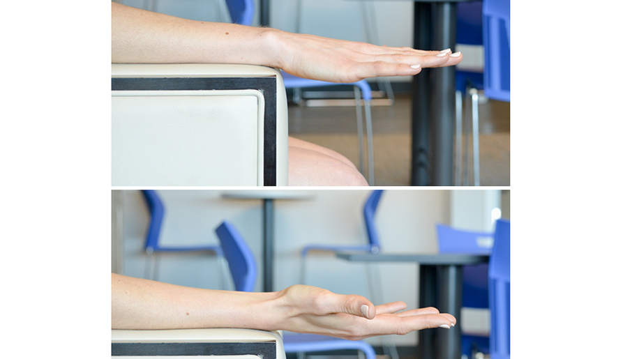 Person exercises hand by rotating and flexing wrist. 