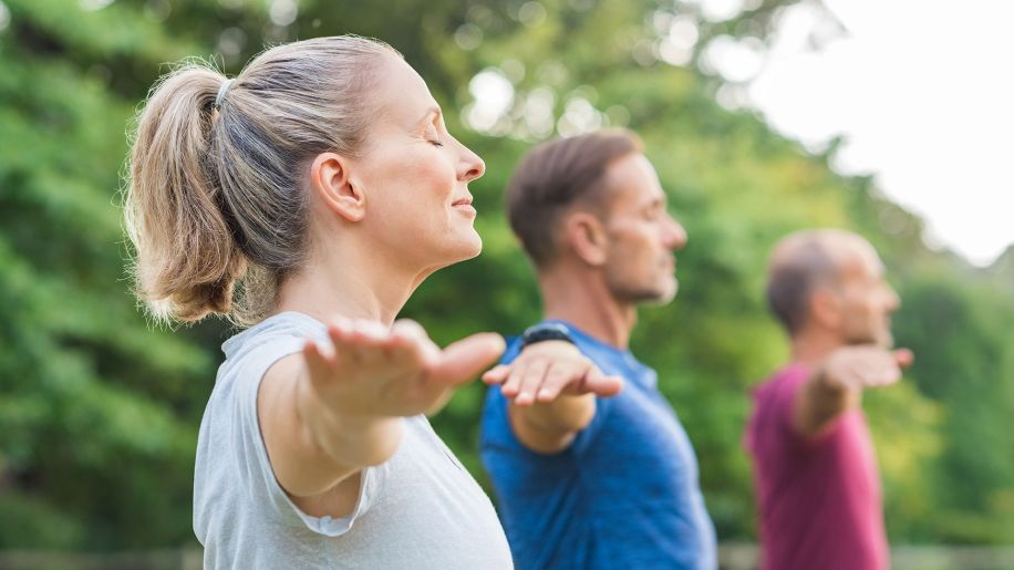 stretching, yoga, outdoors, arms outstretched, warrior pose