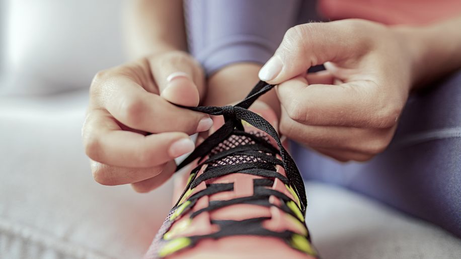 Lacing up shoes for the next workout.