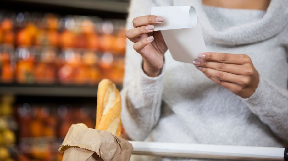 woman with shopping cart, receipt