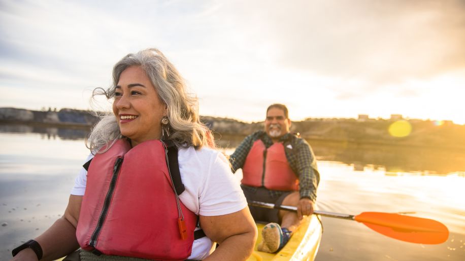 Happy mature couple kayaking