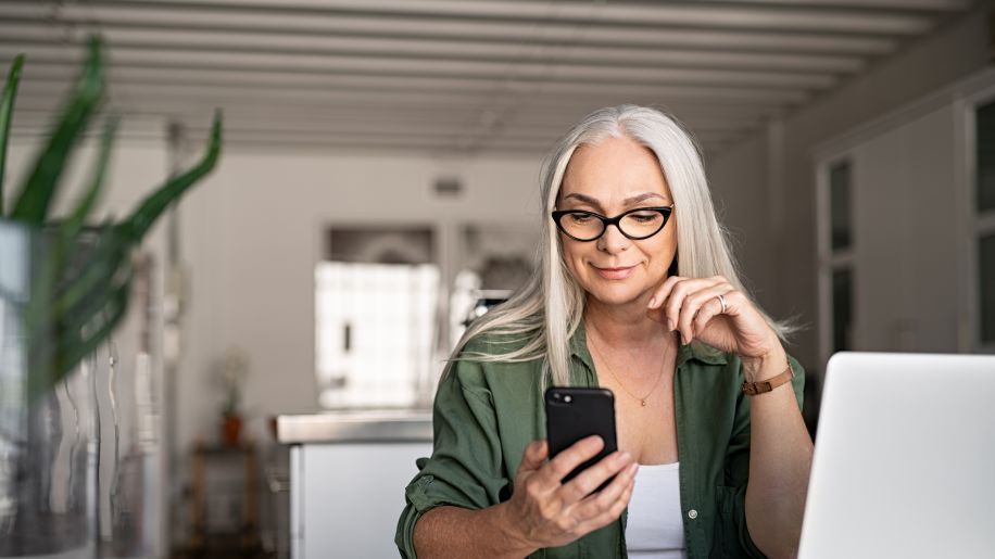 woman looking at phone to see online menu