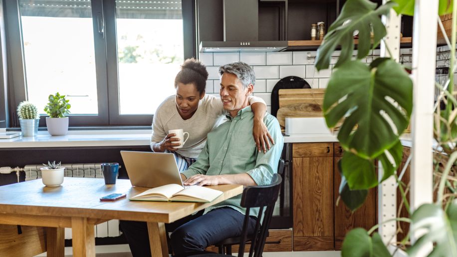 couple reviewing bills and discussing budget