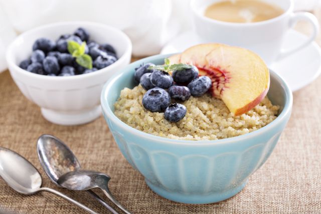 Breakfast quinoa porridge with fresh fruits in a bowl