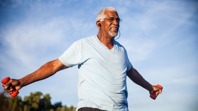 senior black man exercising, elderly man lifting dumbells