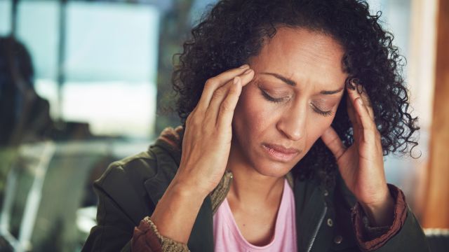 Woman experiencing headache