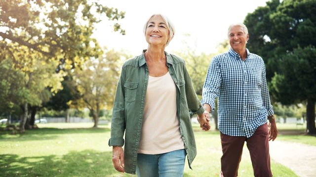 older couple walking hand in hand